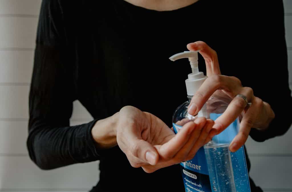 clean hands with sanitizer